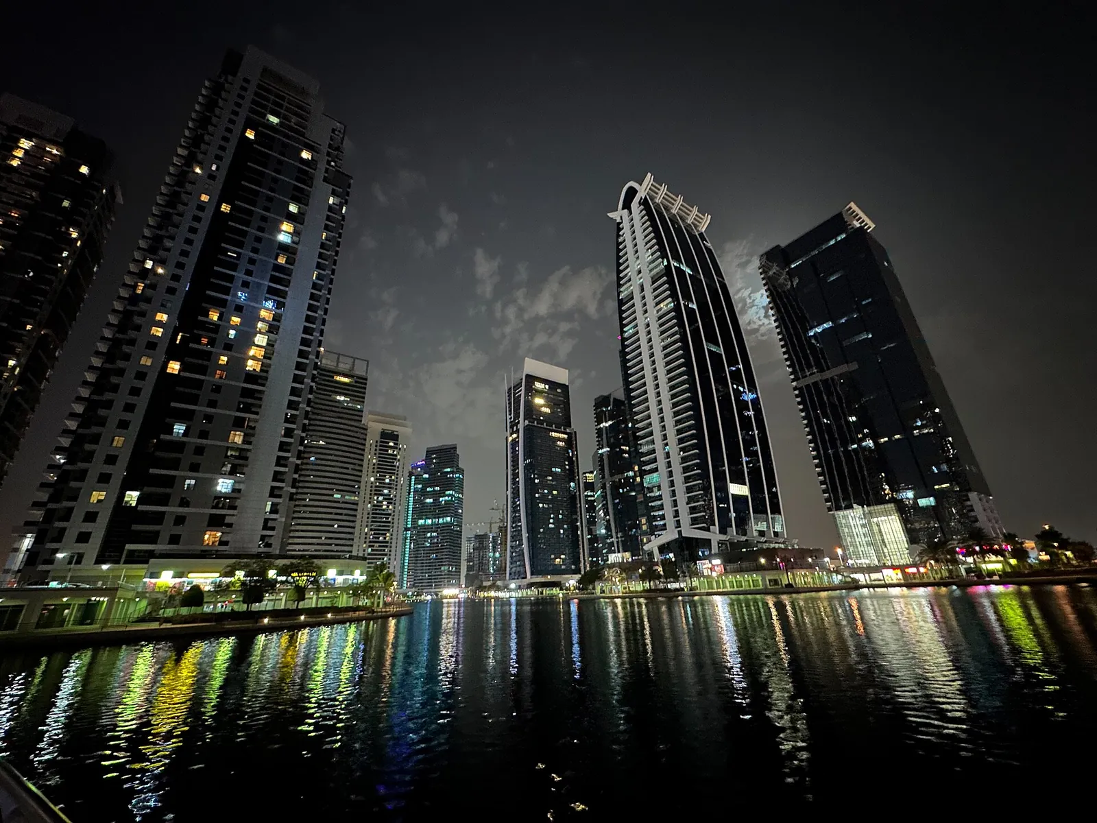 Jumeirah Lakes Towers in Dubai at night, where Zenith Multi Trading DMCC has its office
